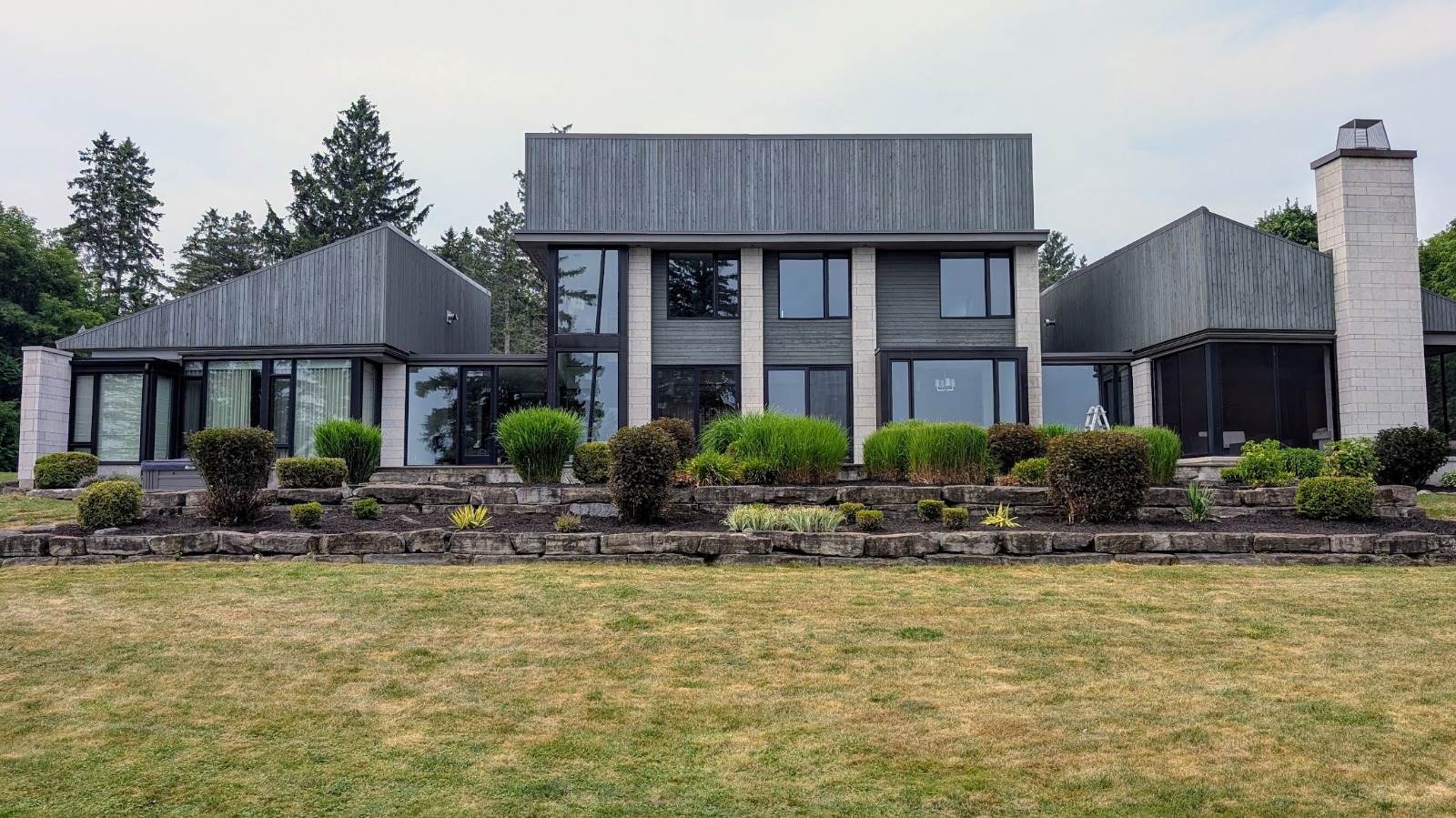 Finished landscaping with mature garden beds and a clean lawn