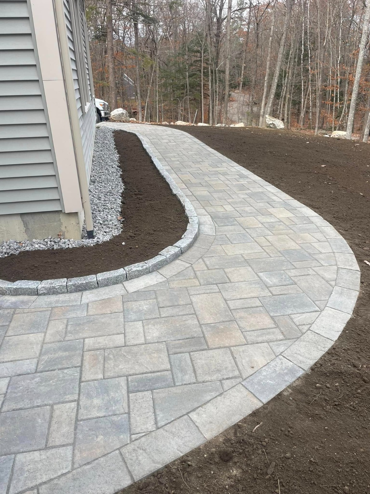 Paver walkway running along the side yard of a home in Cornwall, Ontario